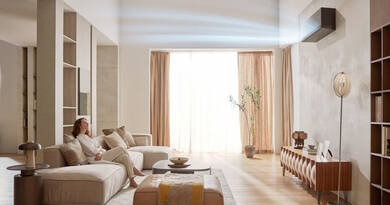 Korszerű LG klíma fűtés üzemmódban, az AI Air légterelési technológia szemléltetése a nappaliban.